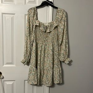 Beautiful floral dress. Smocked at top NWT size large